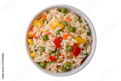 Delicious white boiled rice with vegetables, sweet peppers, carrots, peas