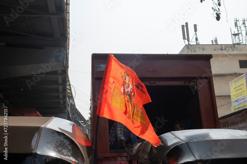  22 January 2024 On the inauguration day of Ram temple the auto rickshaw driver celebrated by hoisting a saffron flag in the name of Ram at Goreegaon west Mumbai India