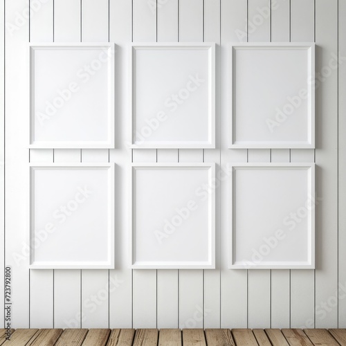 Set of Six White Frames Hanging on Wall