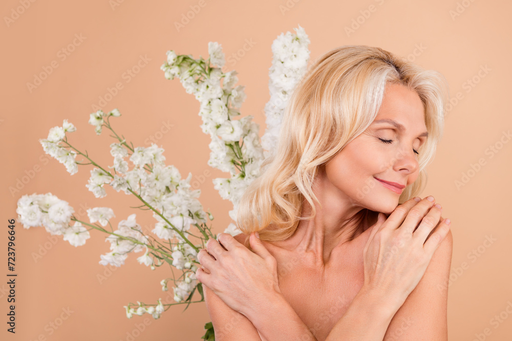 Photo of sweet pretty cute woman hugging herself natural smell fresh flawless skin isolated on beige color background
