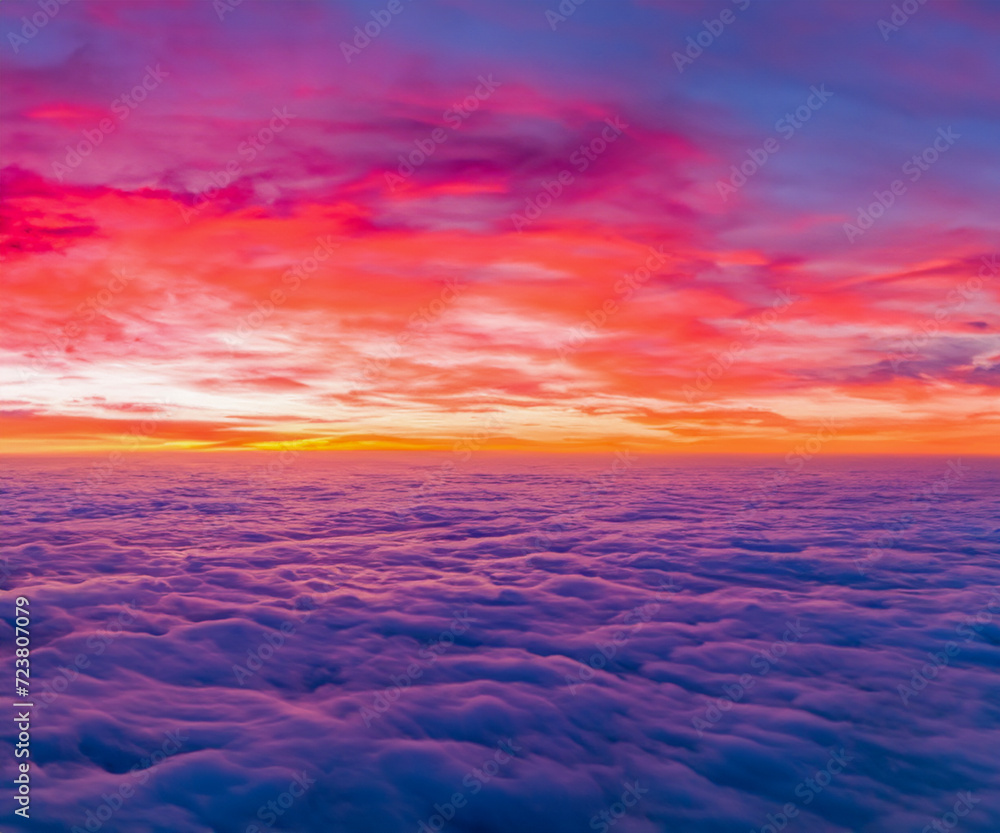 Ideal for Sky replacement project: colorful pink-orange-blue dramatic sky with clouds illuminated by red sunset, aerial photography, far horizon without obstacles.