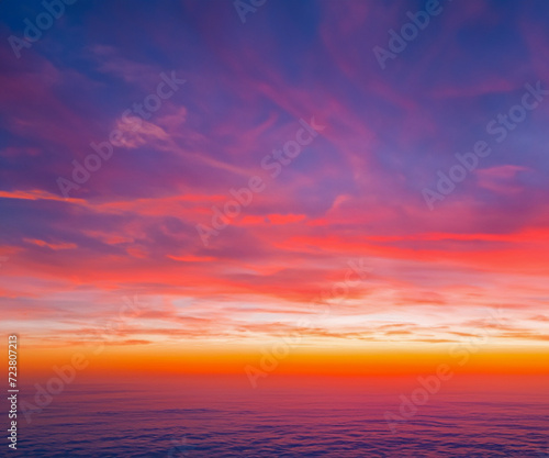 Ideal for Sky replacement project: colorful pink-orange-blue dramatic sky with clouds illuminated by red sunset, aerial photography, far horizon without obstacles. © squallice