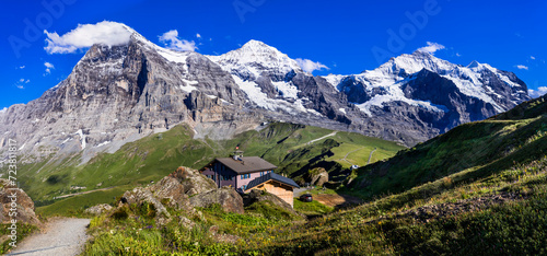 amazing Swiss nature . Kleine Scheidegg mountain pass  famous for hiking in Bernese Alps. view of highest peaks Eiger , Monc and Jungfrau, Switzerland travel