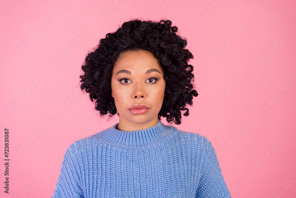 Photo portrait of attractive young woman look calm camera dressed stylish blue knitted clothes isolated on pink color background Photo portrait of attractive young woman look calm camera dressed stylish blue knitted clothes isolated on pink color background