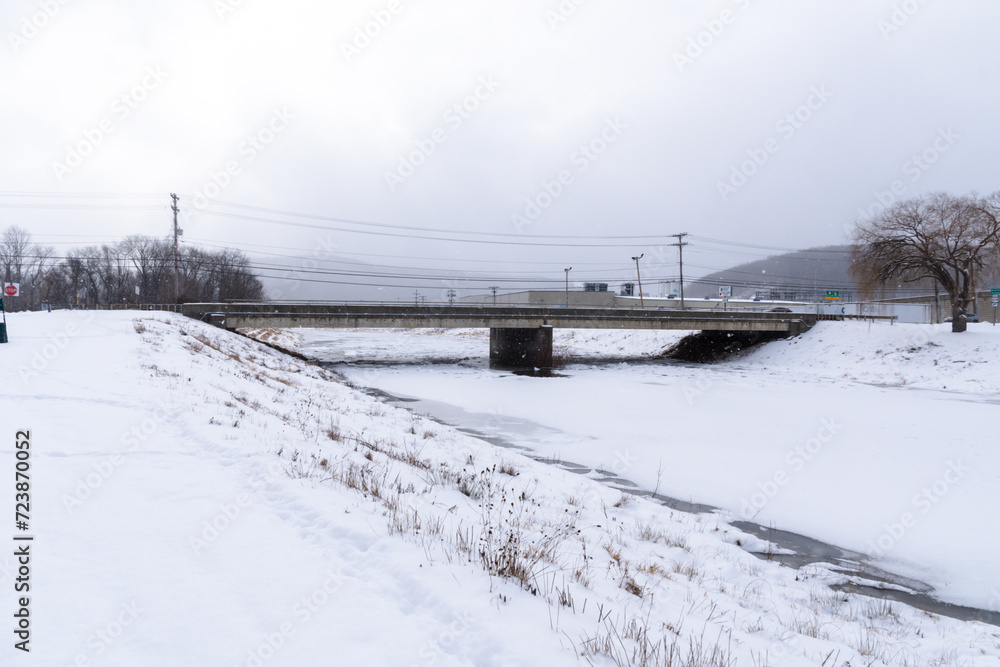 Frozen river park, cold temperatures, extreme weather theme Frozen river park, cold temperatures, extreme weather theme