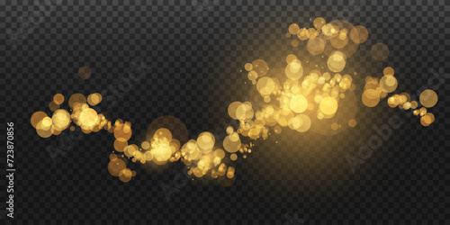 Luminous bokeh softly shimmering with golden light. Light abstract glowing lights. Glowing bokeh effect isolated on transparent background. Christmas background made of glowing dust.