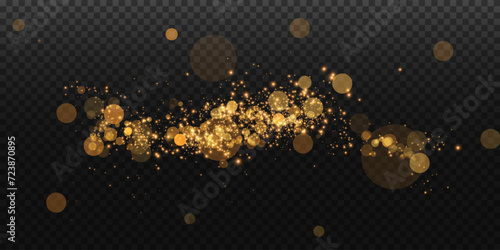 Luminous bokeh softly shimmering with golden light. Light abstract glowing lights. Glowing bokeh effect isolated on transparent background. Christmas background made of glowing dust.