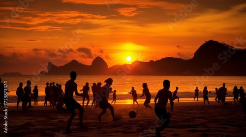 Silhouettes of many people playing beach soccer on the seashore at sunset. Summer vacation, holiday, summer sport, active lifestyle. photo