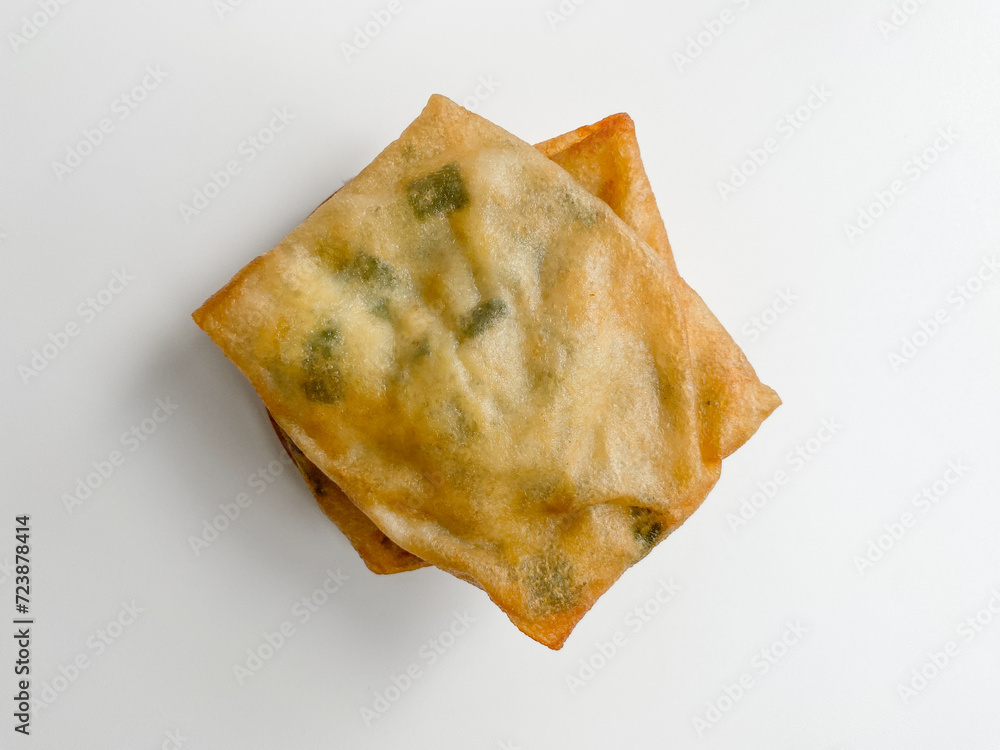 Martabak, made from flour dough, egg and leek slices. Snack from Indonesia. Isolated on white background, flat lay or top view Martabak, made from flour dough, egg and leek slices. Snack from Indonesia. Isolated on white background, flat lay or top view