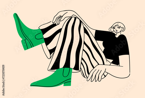 Stylish fashionable sitting woman with irregular body proportions in striped pants