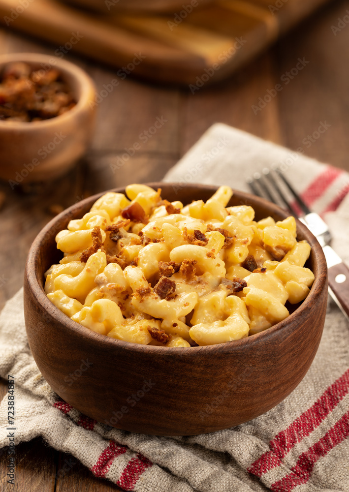 Bowl of macaroni and cheese with bacon pieces