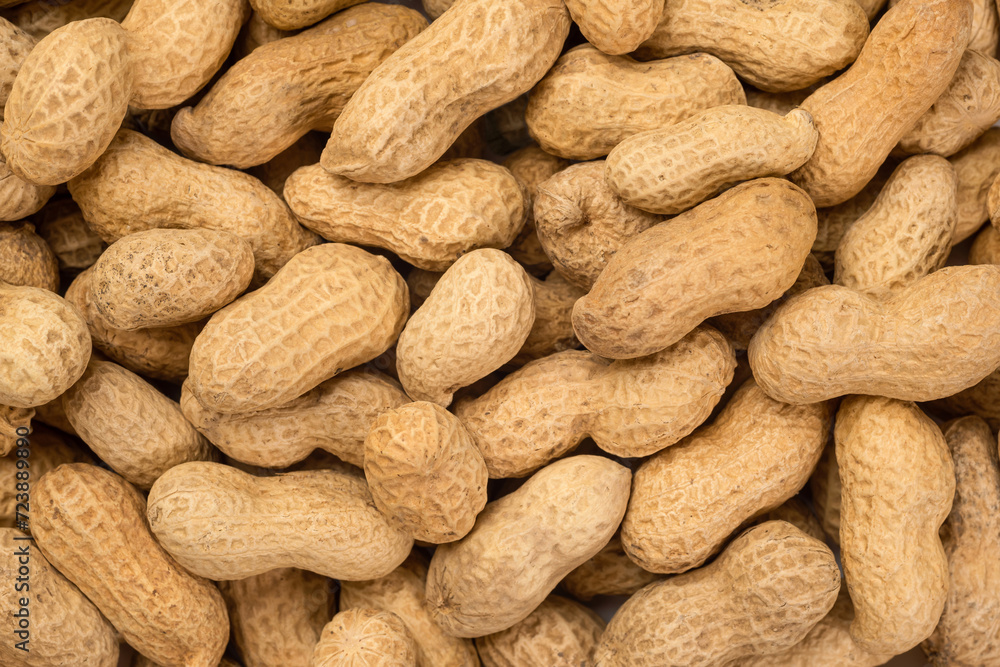 Background image of raw peanuts from above Background image of raw peanuts from above