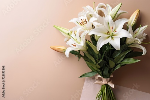 A bouquet of lilies on a background with a postcard.