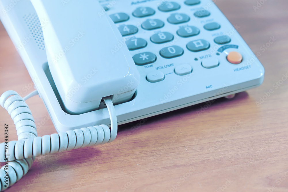 White push-button retro telephone from the 1990s. Shallow depth of field. close-up. White push-button retro telephone from the 1990s. Shallow depth of field. close-up.