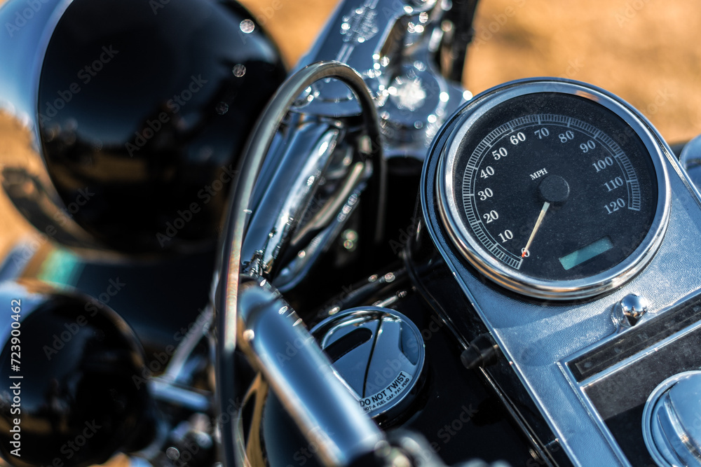 Fototapeta premium Close-up of a vintage motorcycle steering wheel and speedometer.