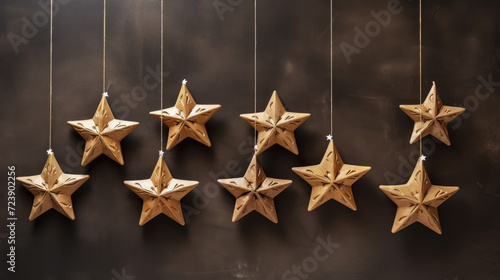 Group of wooden stars hanging from strings. Can be used to add rustic and whimsical touch to any space