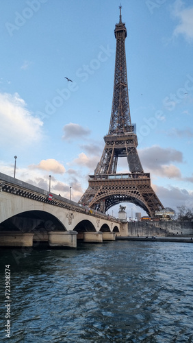 View of the Eiffel Tower from the Seine. Part of the Eifel tower just below it