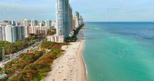 Aerial view of Sunny Isles Beach Miami Florida USA. Sandy Haulover Nude Beach with turquoise water and tall hotels on the coast. photo