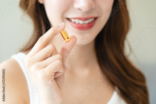Nourishing the Body  Embracing Wellness  A Person Taking Fish Oil Supplements for Optimal Health and Vitality