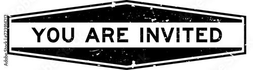 Grunge black you are invited word hexagon rubber seal stamp on white background