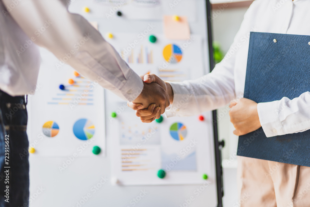 Meeting of business partners shaking hands in the office. Meeting of business partners shaking hands in the office.