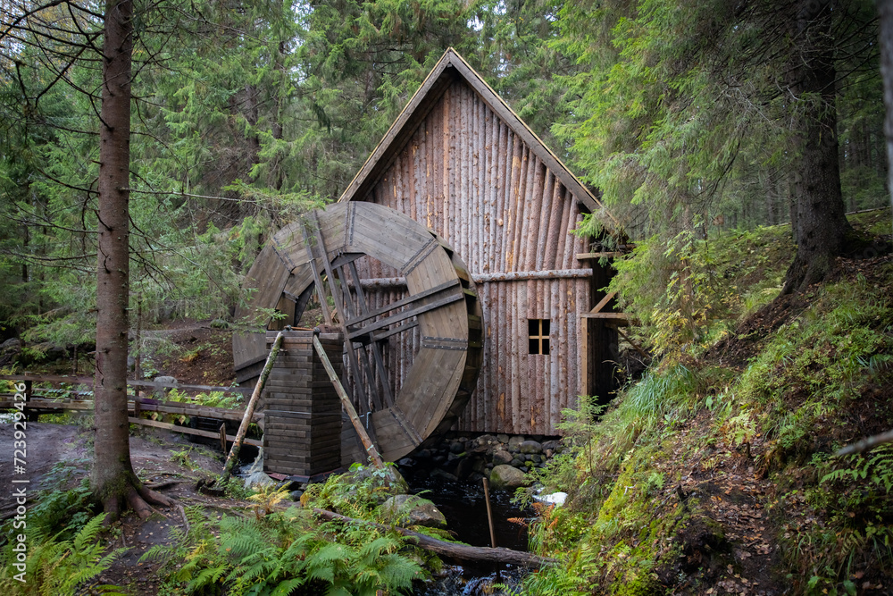 Old wooden water mill in a coniferous forest. Old watermill in the middle of the forest. rural, rustic, Old wooden water mill in a coniferous forest. Old watermill in the middle of the forest. rural, rustic,