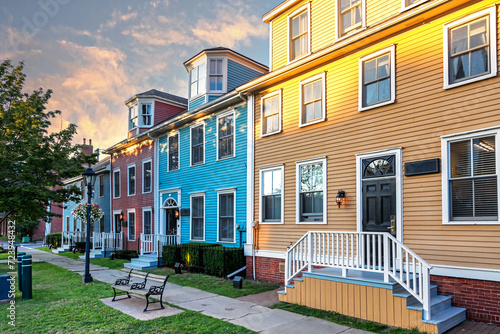The sun sets on a row of the colorful Victorian clapboard houses in Charlottetown, capital of Prince Edward Island, Canada