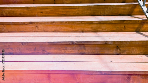 Abstract background with wooden steps of ladder. Pink color toning. Wallpaper going up stairs. Soft focus. film grain pixel texture. Defocused. photo
