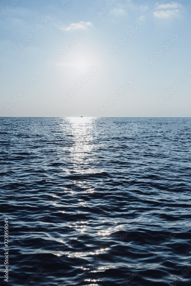 beautiful seascape. The blue sea goes into the horizon. reflection of the sun in the sea.vertical photo of the sea beautiful seascape. The blue sea goes into the horizon. reflection of the sun in the sea.vertical photo of the sea