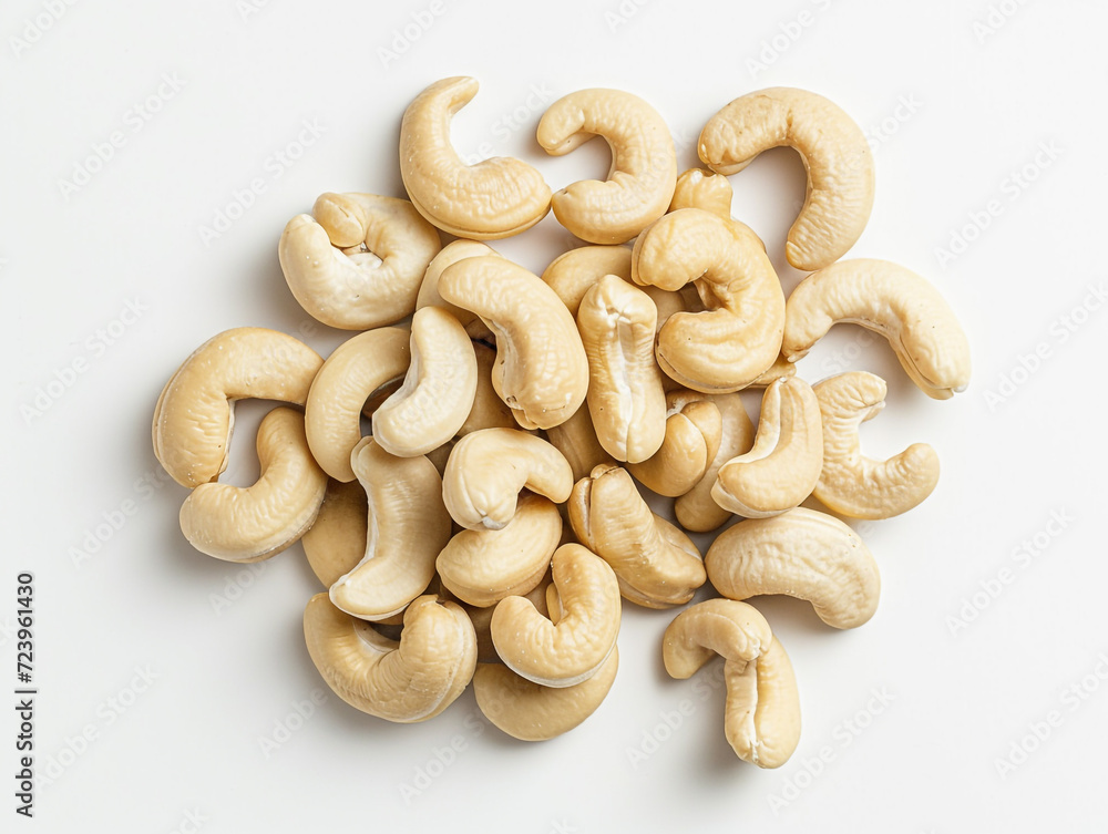 Cashews isolated on white background in minimalist style. Studio photography. Cashews isolated on white background in minimalist style. Studio photography.