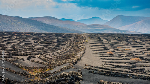 Astonishing volcanic ash and basaltic rock structures buit by local to produce high quality wine despite the extremely arid and windy conditions
