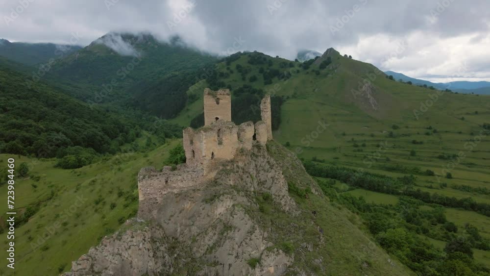 Aerial video of the ruins of Trascau medieval citadell in Romania. Footage was shoot from a drone while flying backwards with camera level for a landscape view of the ruins, on a rainy weather. Aerial video of the ruins of Trascau medieval citadell in Romania. Footage was shoot from a drone while flying backwards with camera level for a landscape view of the ruins, on a rainy weather.