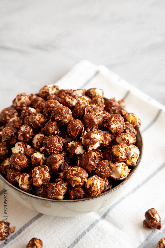 Homemade Chocolate Caramel Popcorn in a Bowl, side view. Homemade Chocolate Caramel Popcorn in a Bowl, side view.