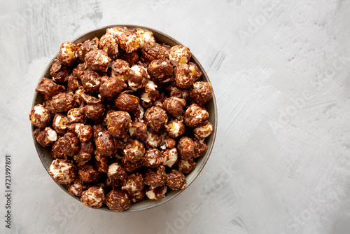Homemade Chocolate Caramel Popcorn in a Bowl, top view. Flat lay, overhead, from above. Copy space.