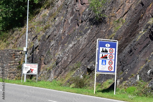 driving rules sign in Luxemborug with the speed trap warning right behind photo