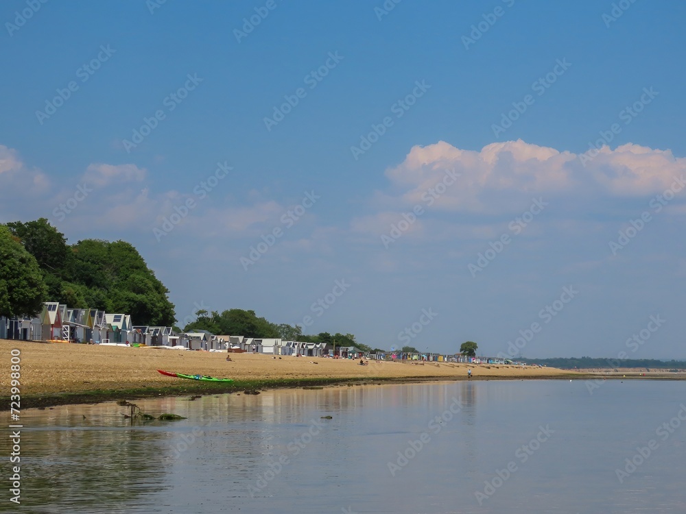 beach huts at Calshot Hampshire England on a bright sunny day beach huts at Calshot Hampshire England on a bright sunny day