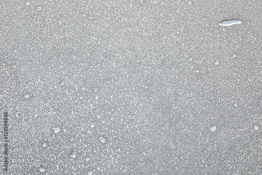 Close-Up of Grainy Concrete Stone or Asphalt Texture on a Sunny Day