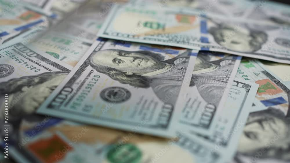 Multitude of hundred dollar bills caught in mid-fall onto spinning surface. Wealth and abundance concepts . Multitude of hundred dollar bills caught in mid-fall onto spinning surface. Wealth and abundance concepts .