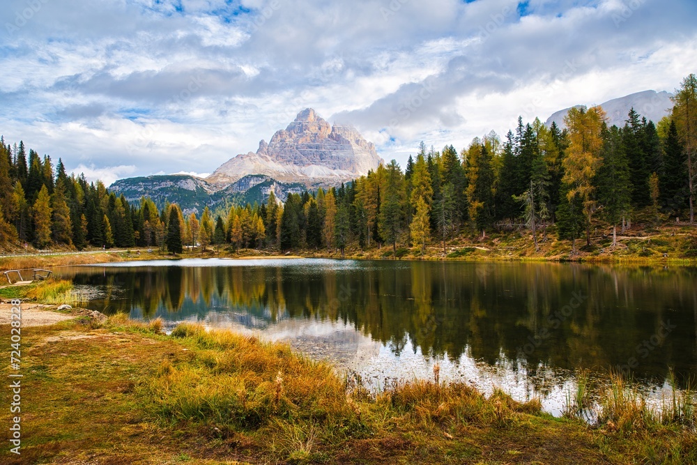 Dolomites Mountains, forest and lake in autumn season. Italy