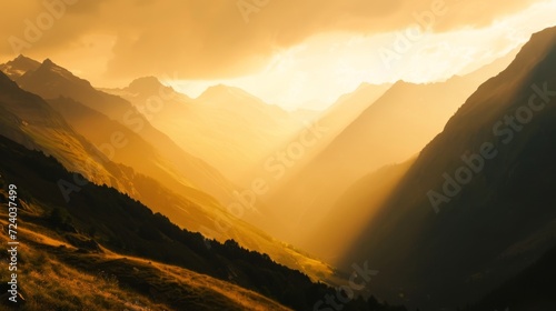 A majestic mountain landscape at dawn, with golden sunlight illuminating the peaks and valleys