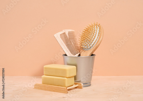 Wooden combs for hair care and two pieces of handmade soap. Eco friendly toiletries.