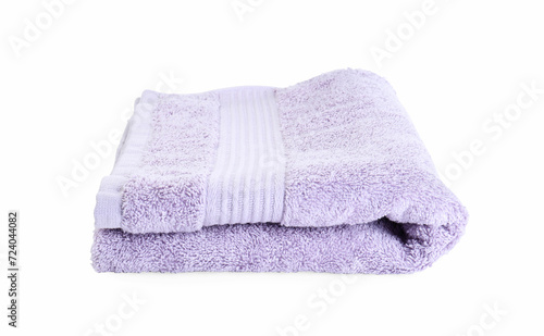 Folded violet terry towel isolated on white