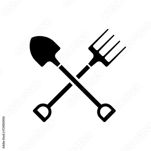 Crossed shovel and pitchfork icon. Black silhouette. Front side view. Vector simple flat graphic illustration. Isolated object on a white background. Isolate. photo