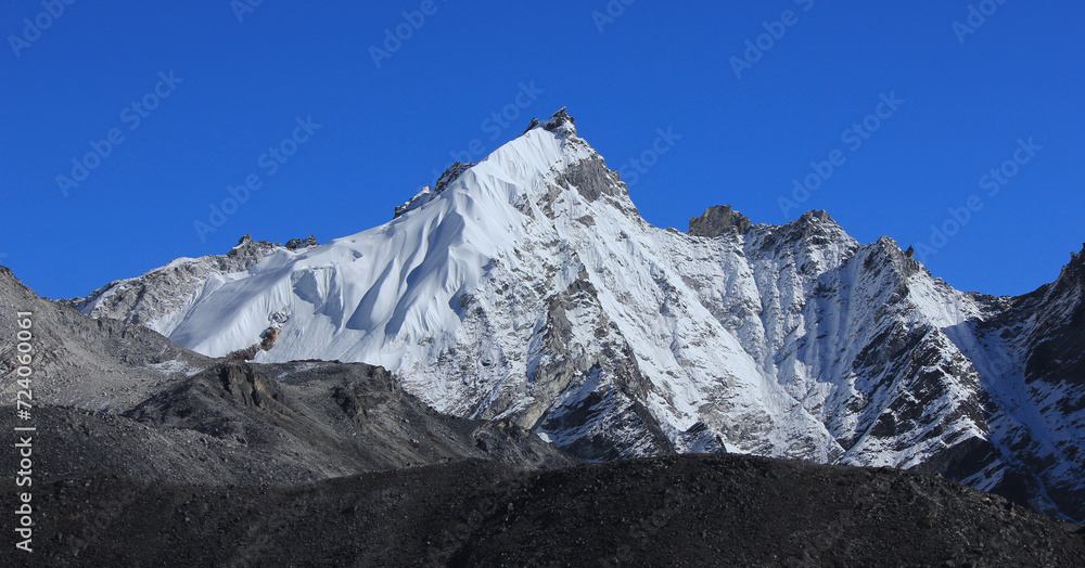 Fototapeta premium Azure blue sky over a mountain seen from Gorakshep, Nepal.