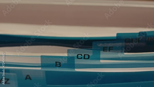 No people closeup of documents folders in file box organizer with index cards sorted in alphabetical order