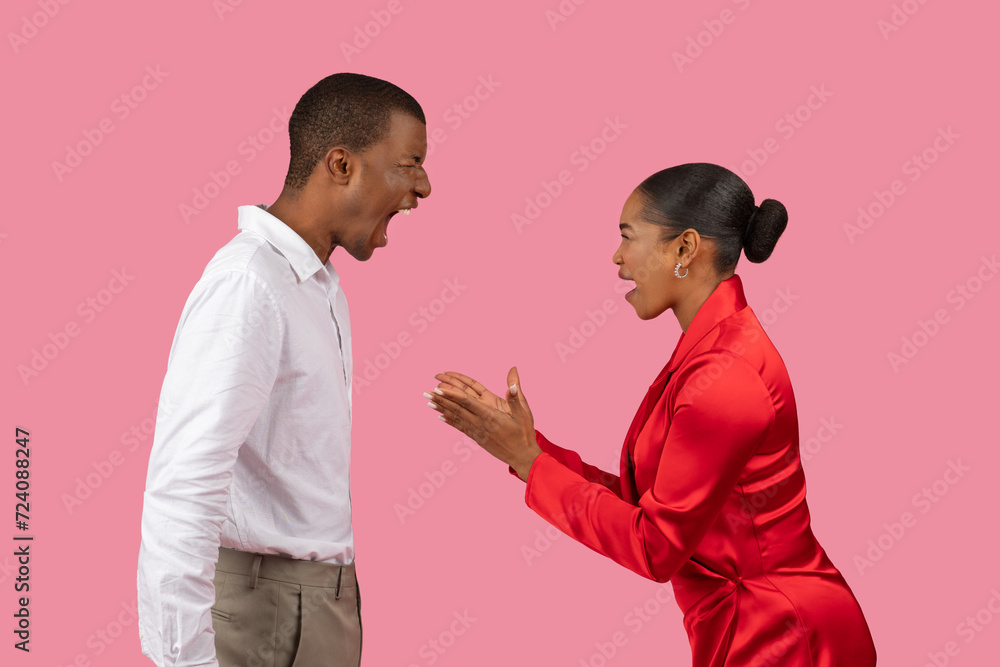 Argument between black man and woman in formal wear Argument between black man and woman in formal wear