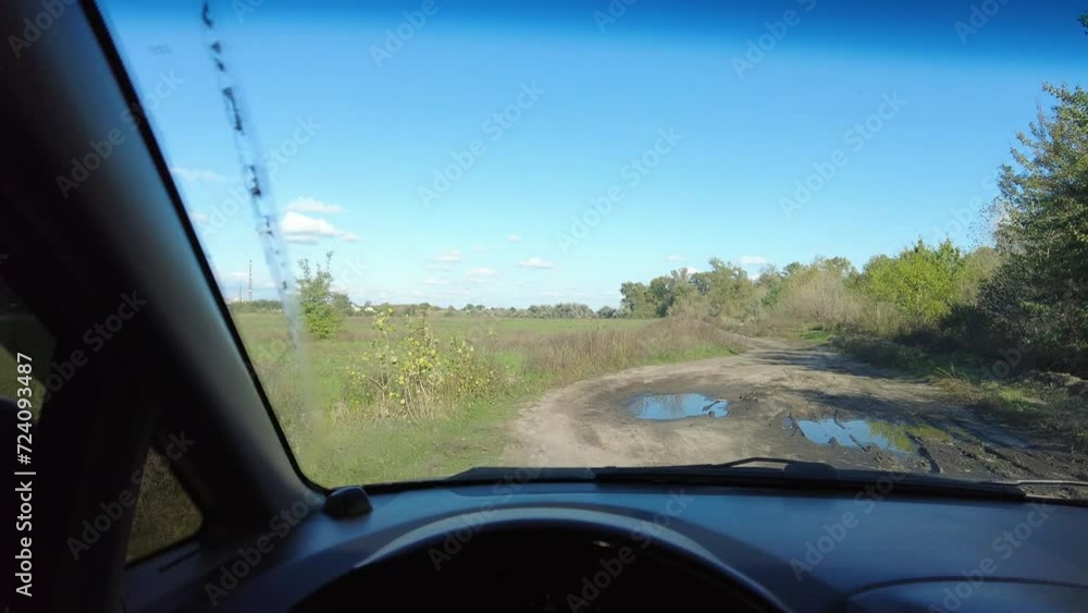 driving a car. analog auto. the driver holds the steering wheel. road trip.