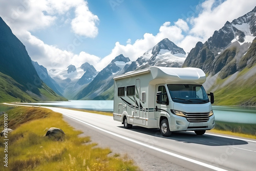 motorhome Traveling on Scenic Mountain Road by the Lake in Summer. Freedom vacation travel concept © Renata Hamuda