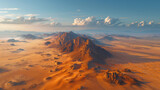 Golden hour light over desert mountains, vast landscape.
