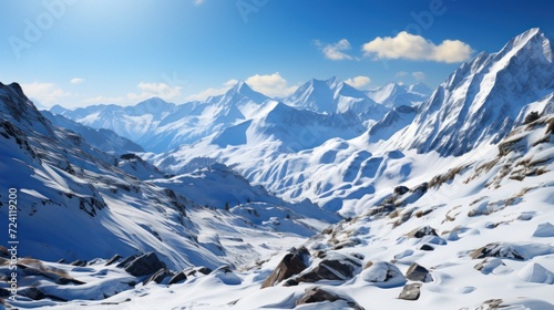 Beautiful winter mountains panorama with snow covered peaks and blue sky